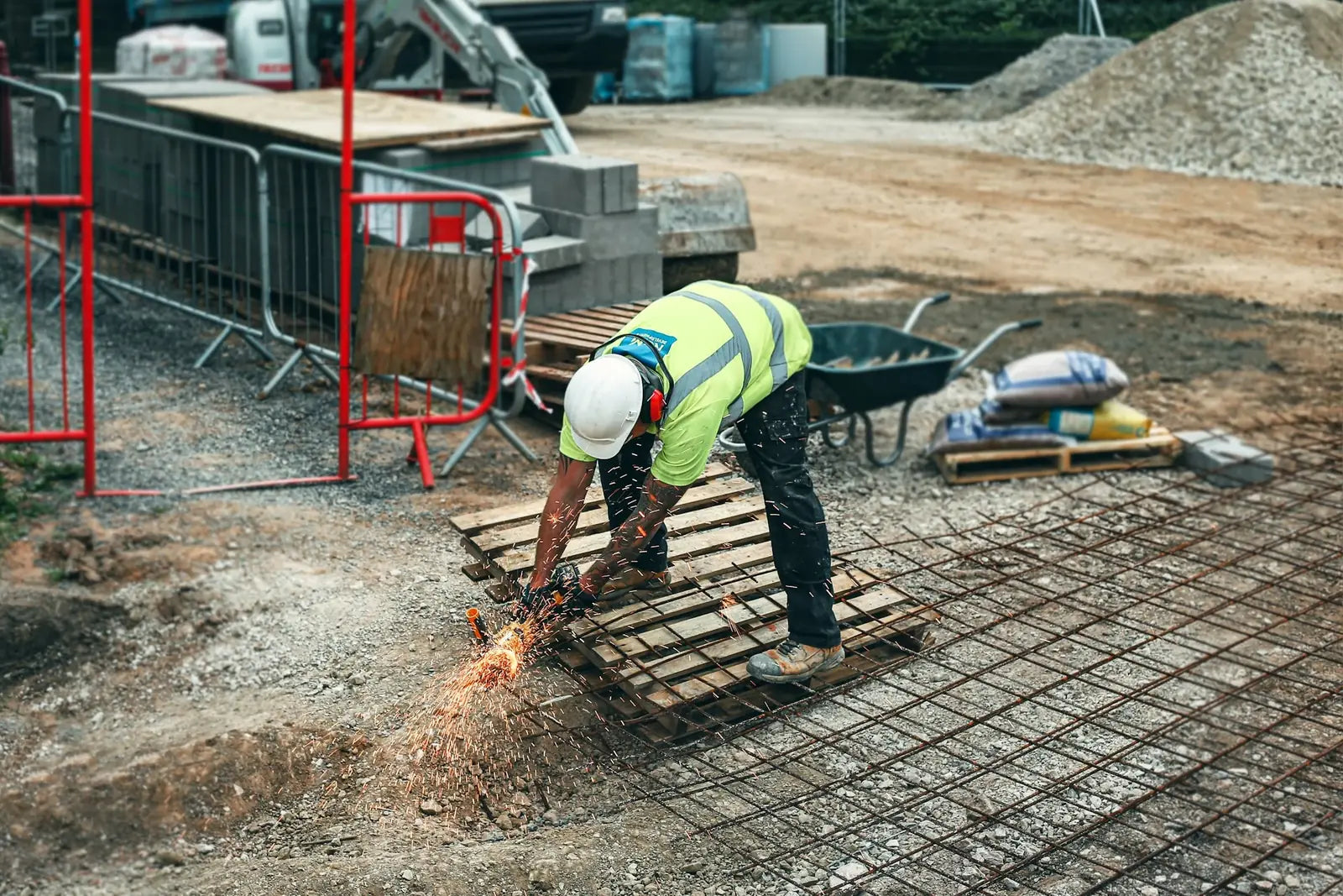 Worker cutting rebar mesh on a site