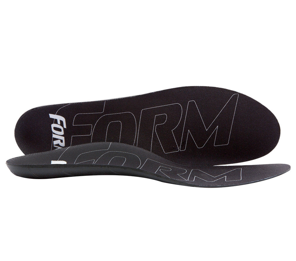 A pair of black insoles designed for comfort and pain relief, with the text 'FORM' on the top surface.